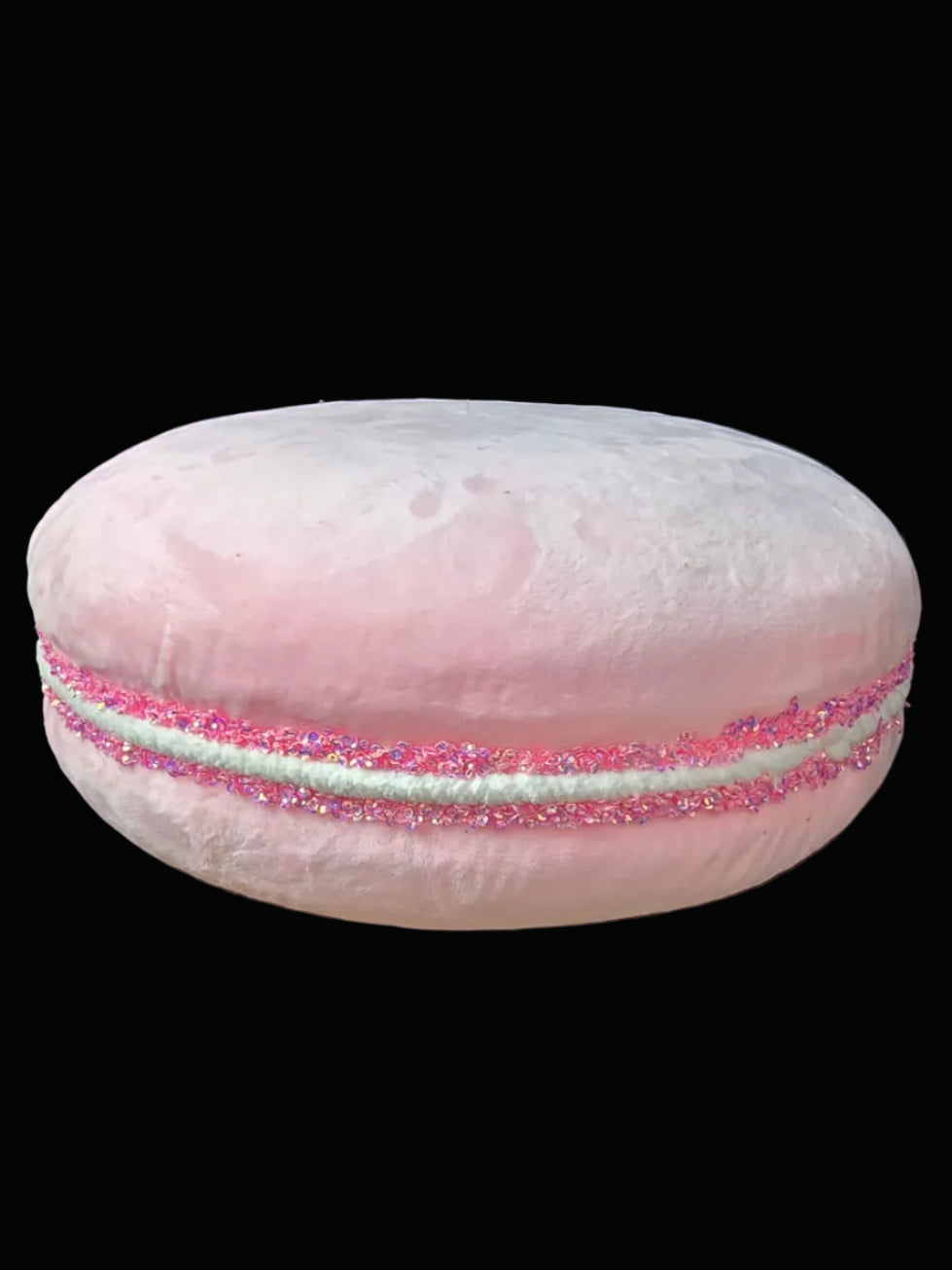 Pink macaron on a dark background