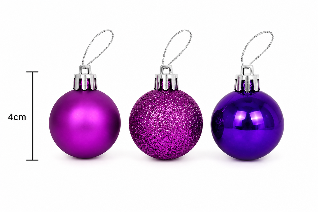 Three 4cm Christmas baubles side by side showing matte magenta, glitter magenta and glossy purple finishes with size measurement