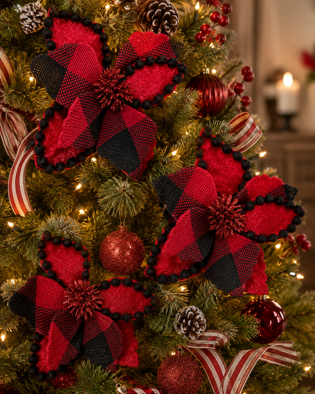 Buffalo plaid poinsettia Christmas tree picks clipped onto a lit Christmas tree with pinecones and ribbon