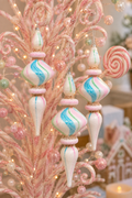Pastel watercolour glass diamond finial ornaments hanging on a pink candy-themed Christmas tree, showing the diamond centre shape with pink, blue and mint swirl detailing and rose gold glitter bands