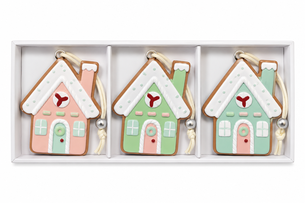 Set of 3 pastel gingerbread house Christmas ornaments in a white gift box showing pink, green and mint designs