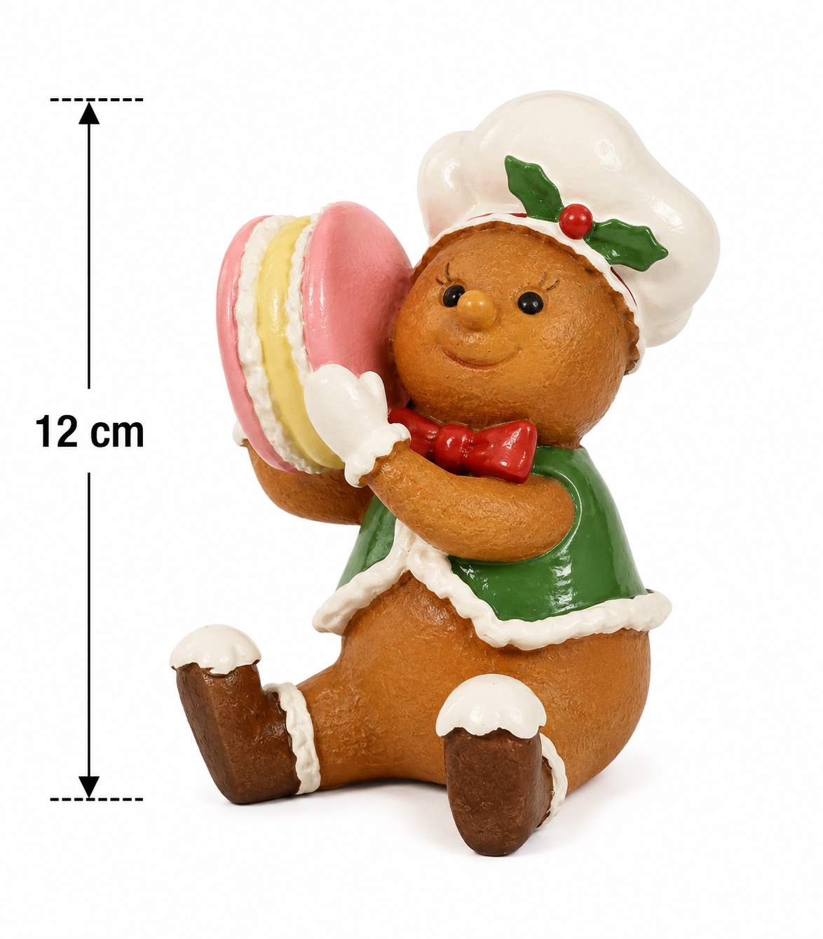 Gingerbread chef figurine on a white background with a measurement arrow showing 12cm height, holding a pink and yellow macaron in green chef's coat and white hat.