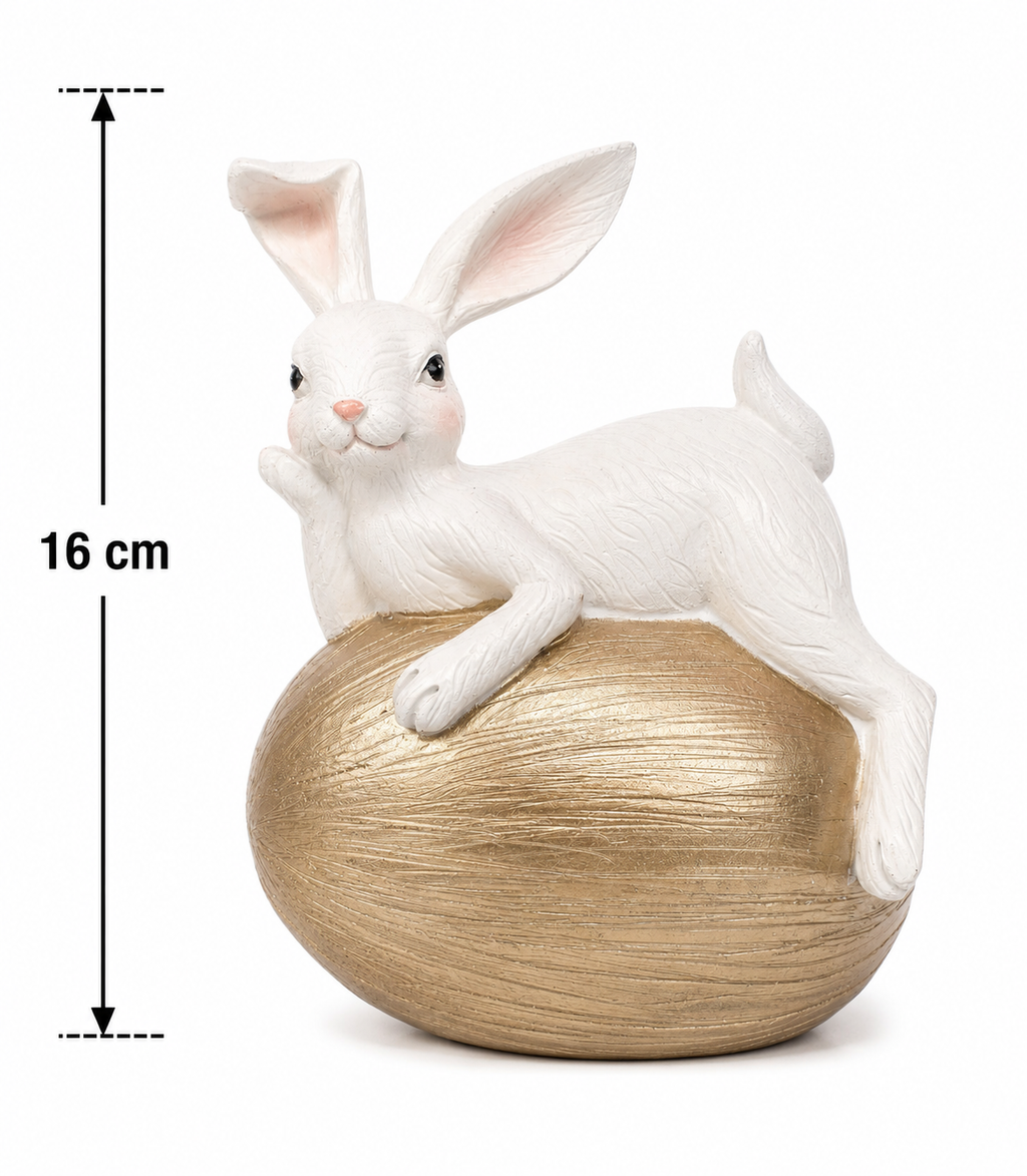 White bunny figurine on a gold textured egg on a white background with a measurement arrow showing 16cm height.