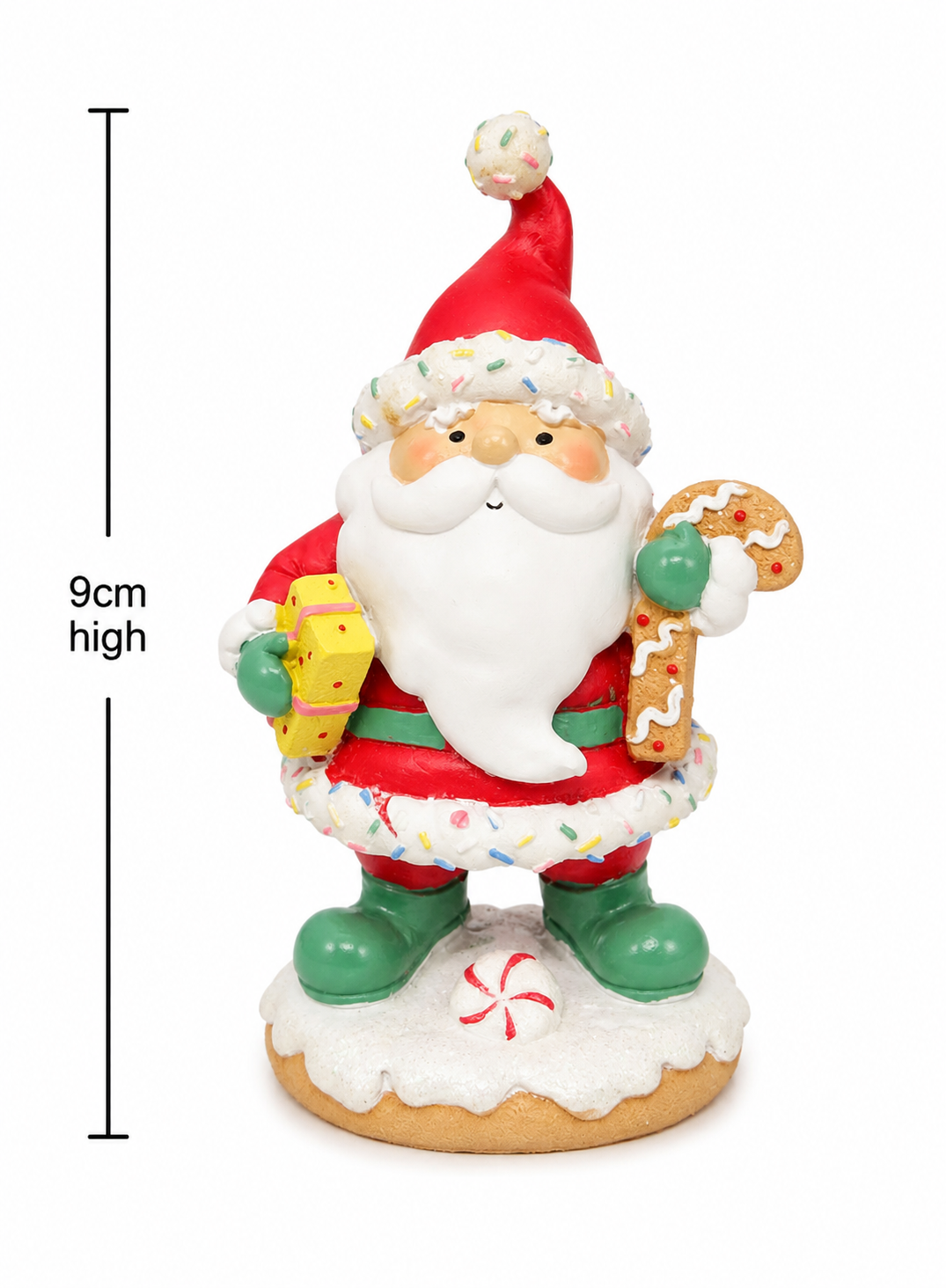 Sprinkle Santa gingerbread figurine on white background showing candy sprinkle detail, gift and gingerbread man, gingerbread base, 9cm high.