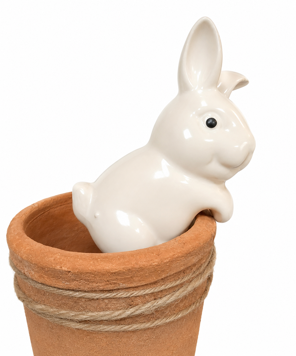 White ceramic bunny pot hanger hooked over a terracotta pot rim on white background, close-up profile view.