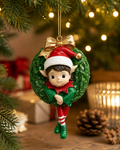 Elf-in-a-wreath Christmas ornament hanging from a pine tree branch with fairy lights, styled with gift boxes, a candle and pinecones in a warm holiday scene.