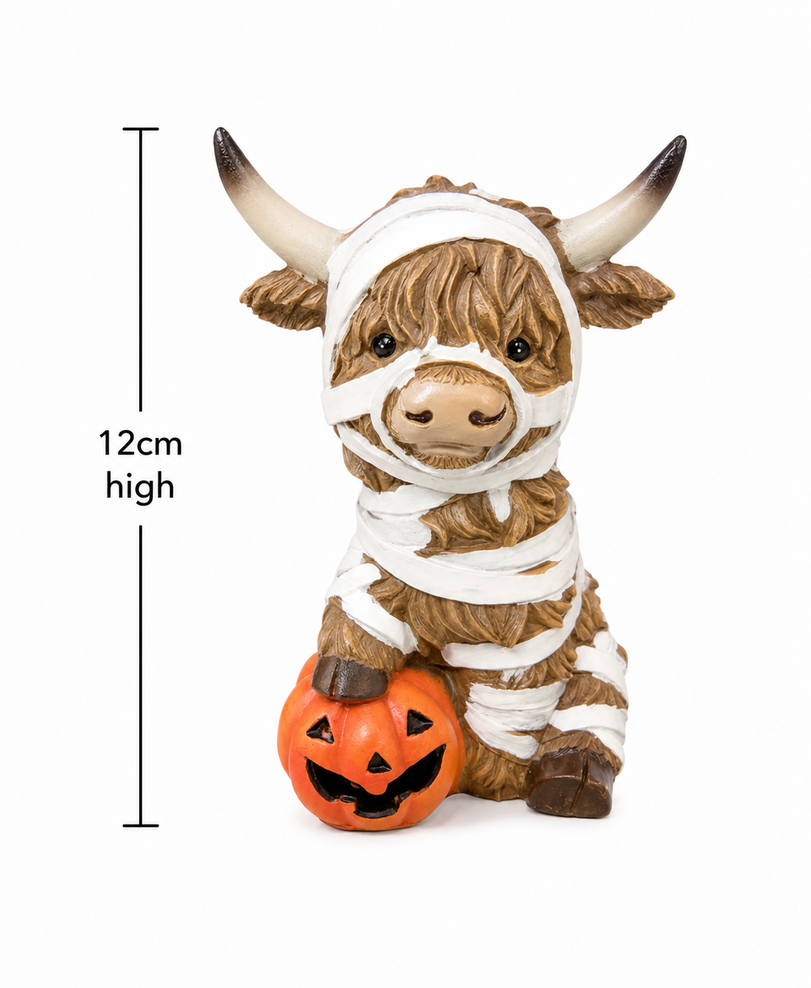 Mummy Highland cow Halloween figurine on white background showing bandage wrap detail, horns and jack-o'-lantern accessory, 12cm high.
