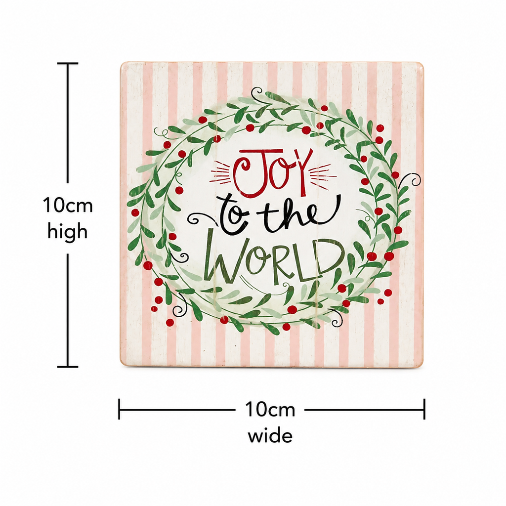Close-up of a single "Joy to the World" ceramic coaster with wreath illustration on pink stripe background, 10cm high by 10cm wide.