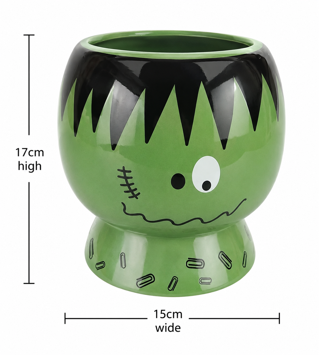 Frankenstein ceramic plant pot on white background showing full design and pedestal base, with dimensions 17cm high by 15cm wide