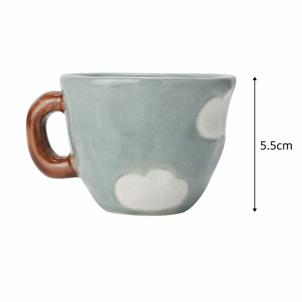 Nini Cup Clouds ceramic mug on white background showing sage green glaze, white cloud motif, and glossy brown loop handle, with 5.5cm height dimension marker