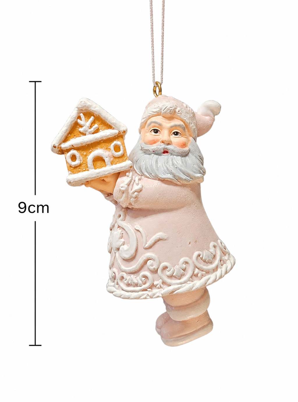 Pastel pink Santa ornament holding a gingerbread house on a white background with a measurement arrow showing 9cm high