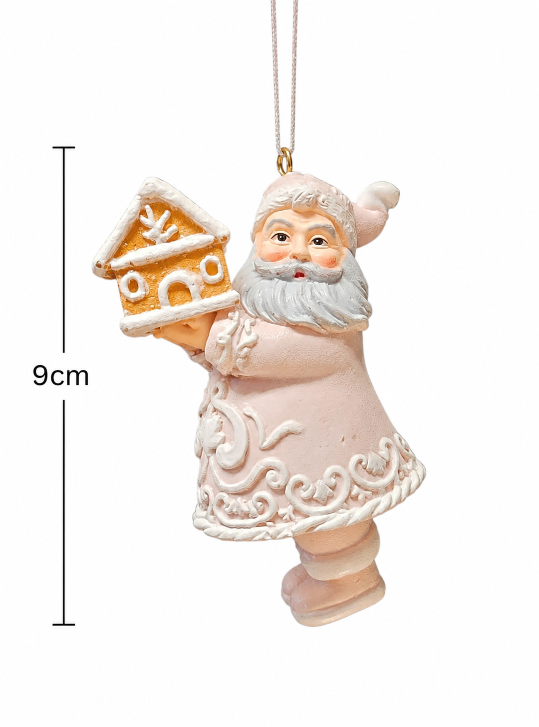 Pastel pink Santa ornament holding a gingerbread house on a white background with a measurement arrow showing 9cm high