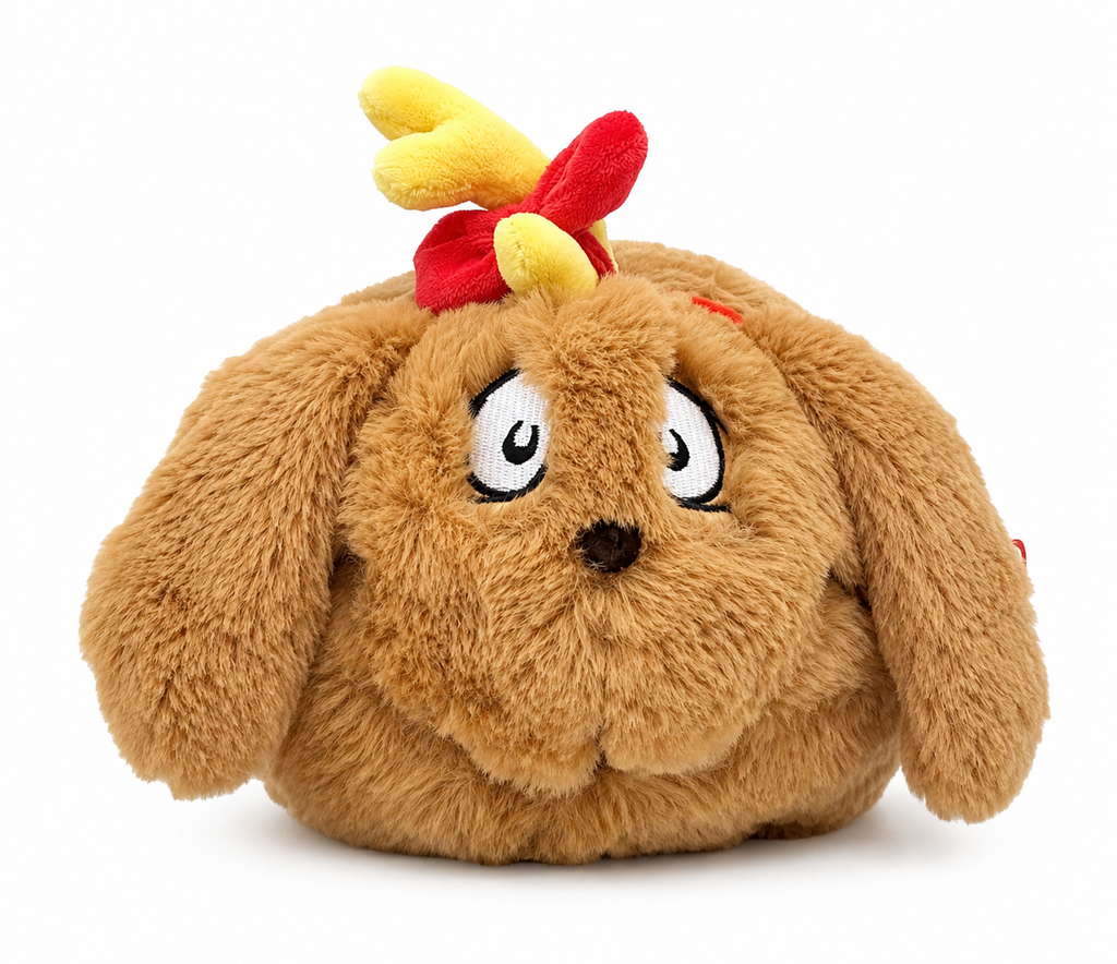 Close-up front view of Max the Dog Spudster plush face showing embroidered white and black worried eyes, dark nose, floppy ears, and yellow plush antler with red bow on top