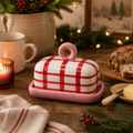  Red gingham butter dish styled in a cosy Christmas kitchen scene with candles, fairy lights, sliced fruit loaf and a butter knife