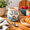 Blue and cream combi van ceramic milk jug styled on timber kitchen bench with strawberries, croissant and blue stripe tea towel