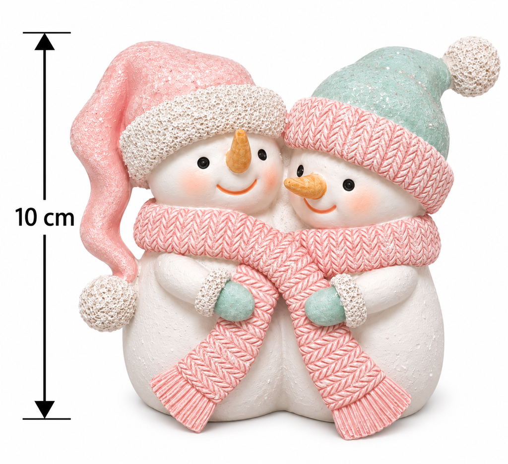 Cuddling snowman couple resin figurine with pink knit scarf, pink hat and mint hat on white, shown with a 10cm height measurement