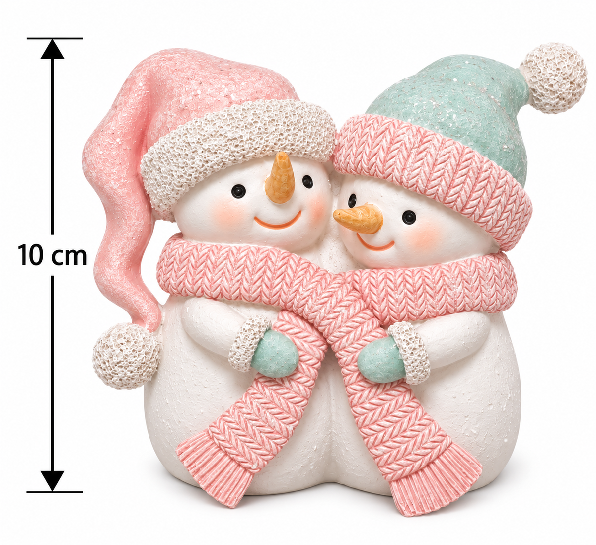 Cuddling snowman couple resin figurine with pink knit scarf, pink hat and mint hat on white, shown with a 10cm height measurement