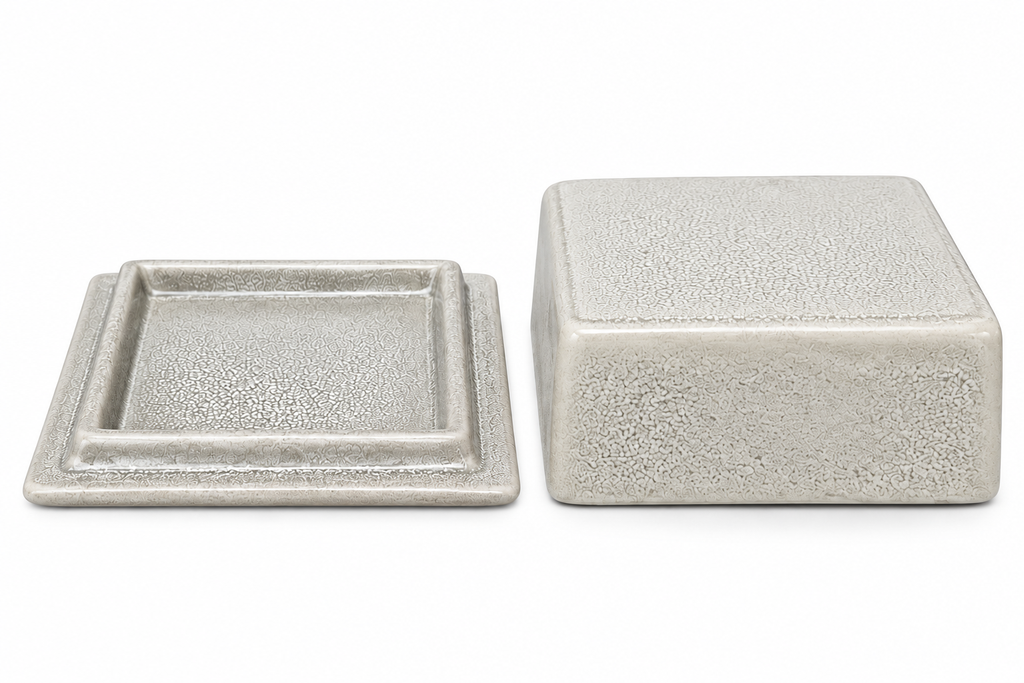 Crackle glaze ceramic butter dish base and lid shown separately on a white background, highlighting the textured crackle finish