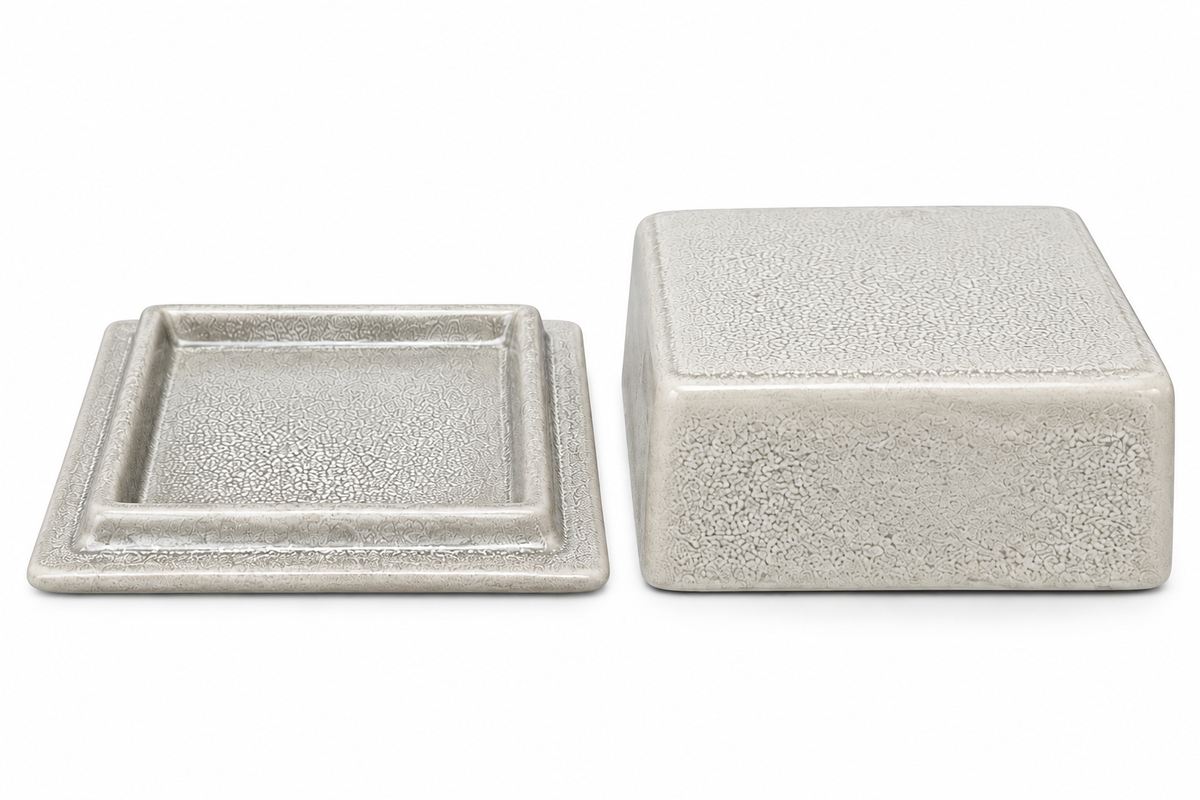 Crackle glaze ceramic butter dish base and lid shown separately on a white background, highlighting the textured crackle finish