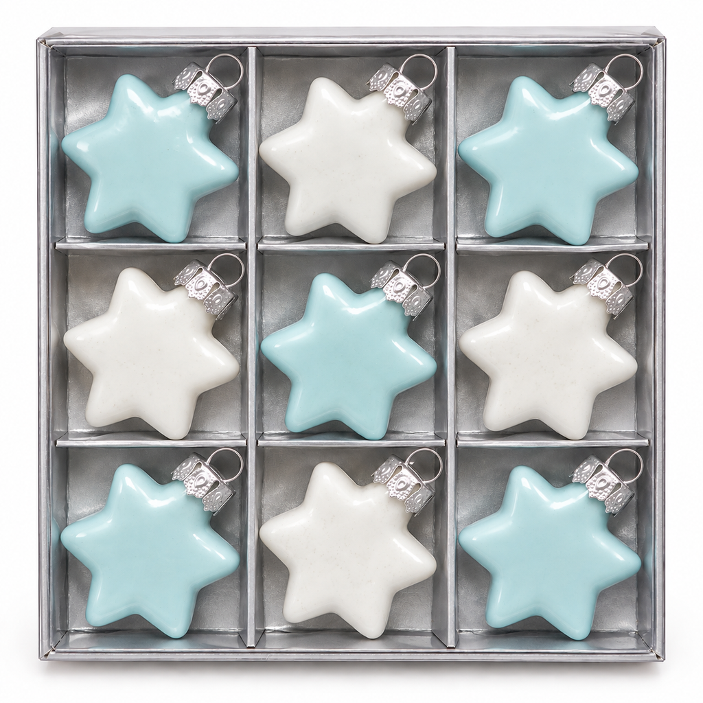 Set of 9 duck egg blue and white glass star ornaments arranged in a silver-tone gift box, three rows of three