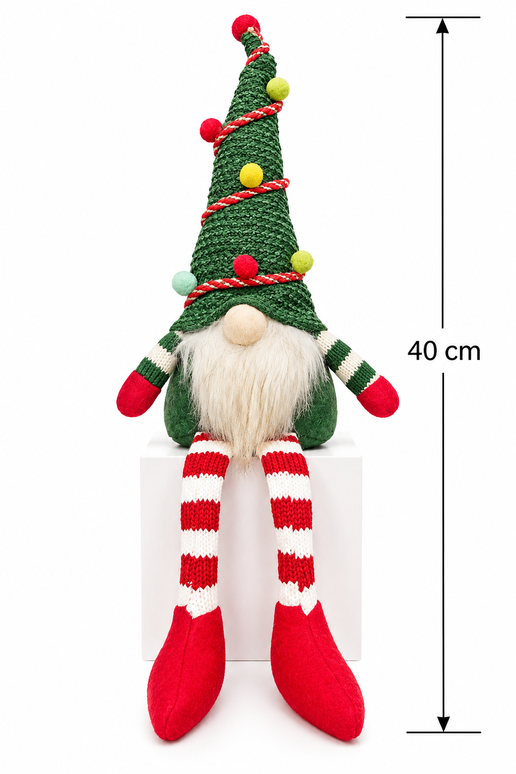 Christmas tree gnome on a white background showing full height of 40cm with striped legs hanging over a display block