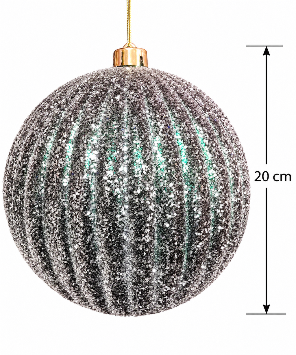 Silver glitter ribbed Christmas bauble on a white background with a measurement arrow marking 20cm diameter and gold cap and cord visible