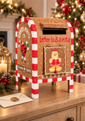 Gingerbread Santa mailbox with candy cane striped frame, a gingerbread girl on the door and “Letter to Santa” lettering, styled on a wooden sideboard with a lantern, pine sprigs, red berries, a sealed envelope and a decorated Christmas tree