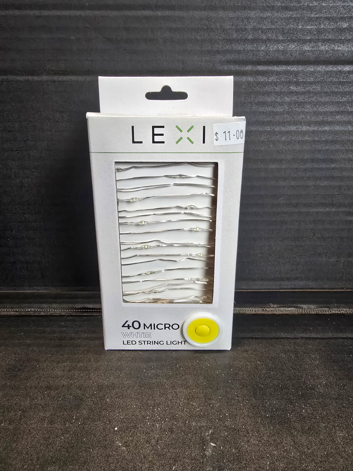 Lexi 40 micro white LED string light in white retail packaging with silver wire lights visible through window — Mistletoe Home