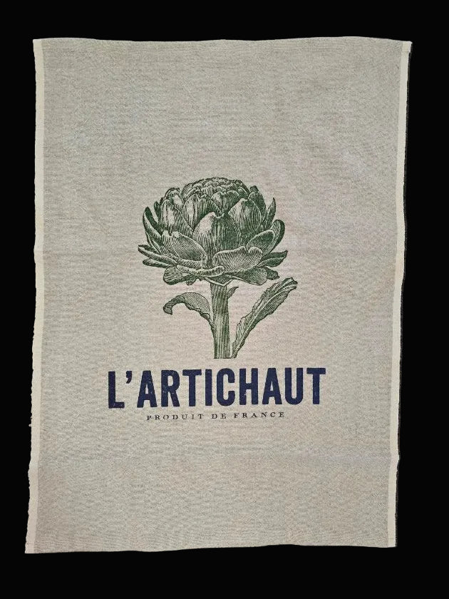  Flat lay of natural oatmeal linen tea towel showing full L'Artichaut Produit de France navy and green artichoke botanical print on black background — Mistletoe Home