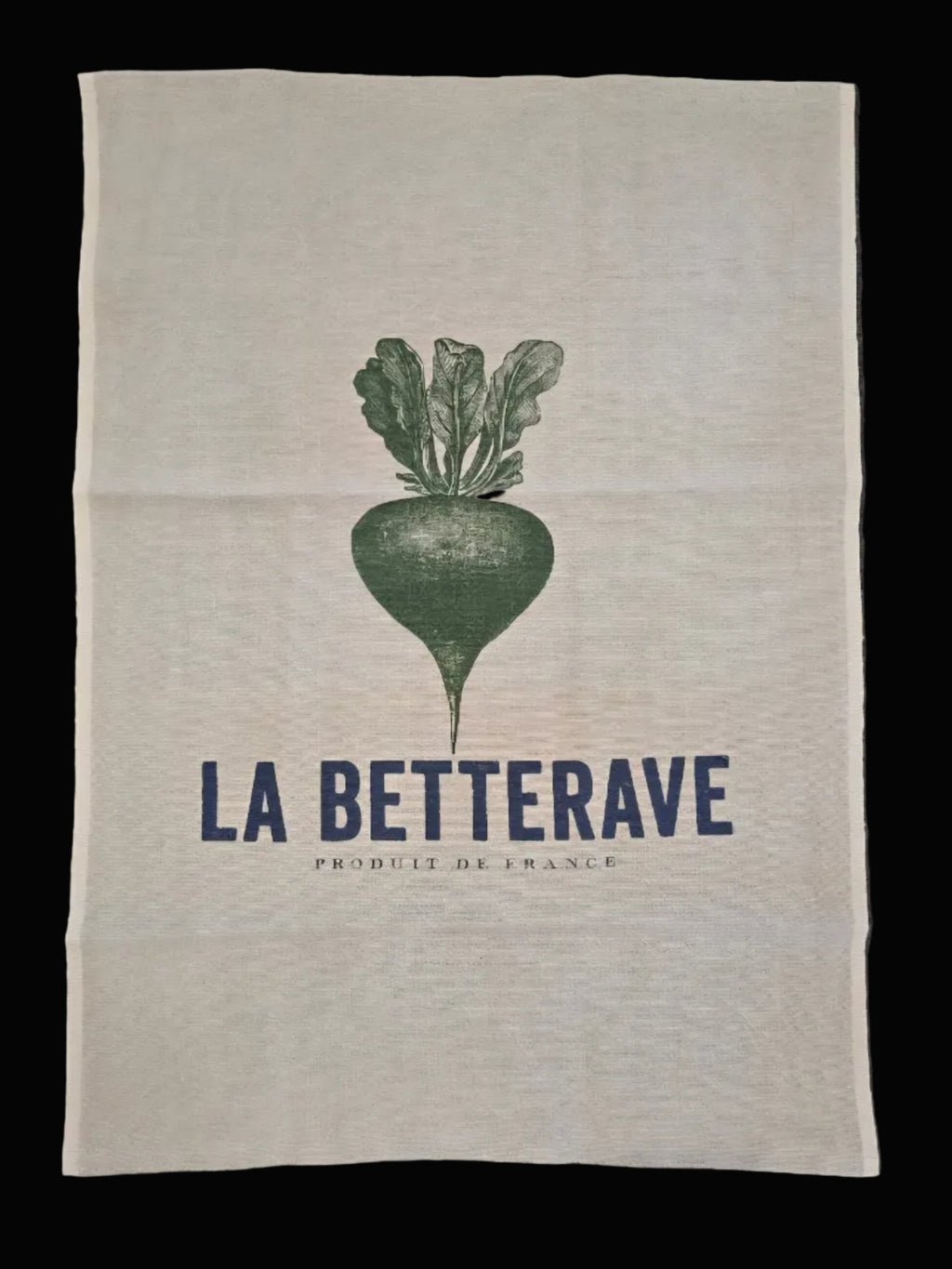 Flat lay of natural oatmeal linen tea towel showing full La Betterave Produit de France navy and green beetroot botanical print on black background — Mistletoe Home
