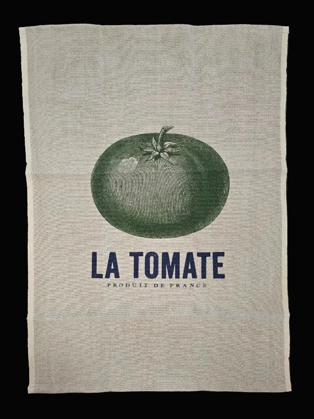 Flat lay of natural oatmeal linen tea towel showing full La Tomate Produit de France navy and green tomato botanical print on black background — Mistletoe Home