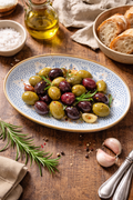 Blue and white oval ceramic serving dish styled with olives and bread on a rustic table — Mistletoe Home Australia