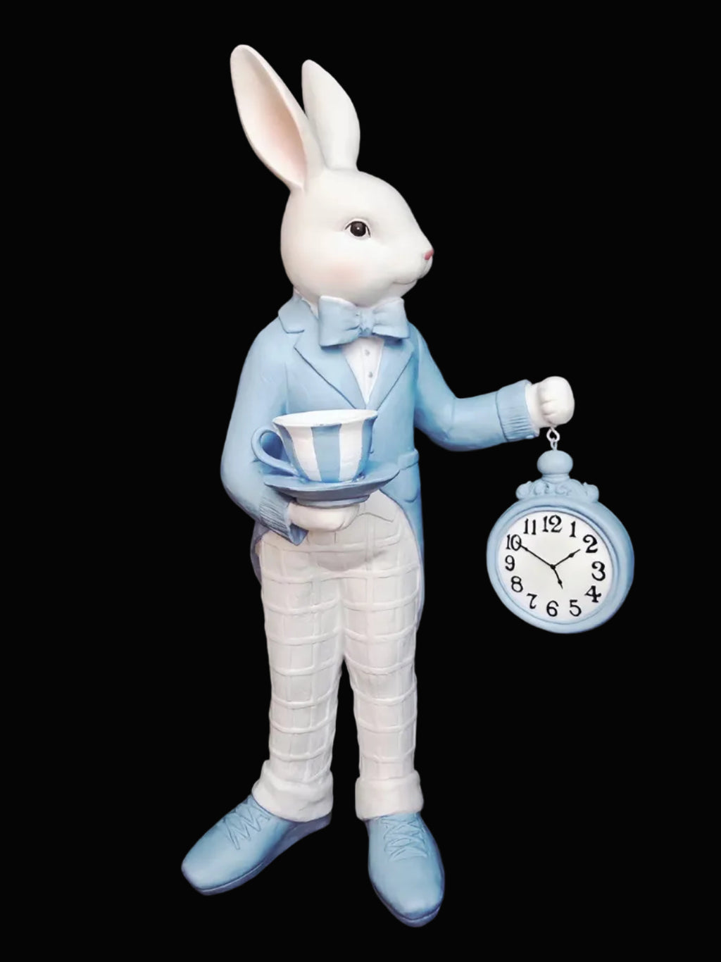 White rabbit figure in a suit holding a teacup and pocket watch against a dark background