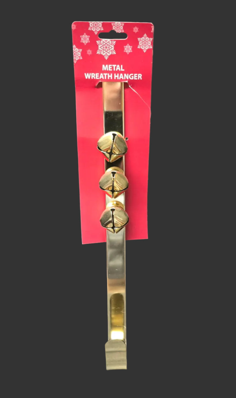 Gold metal over-the-door Christmas wreath hanger with three jingle bells on red packaging — Mistletoe Home Australia