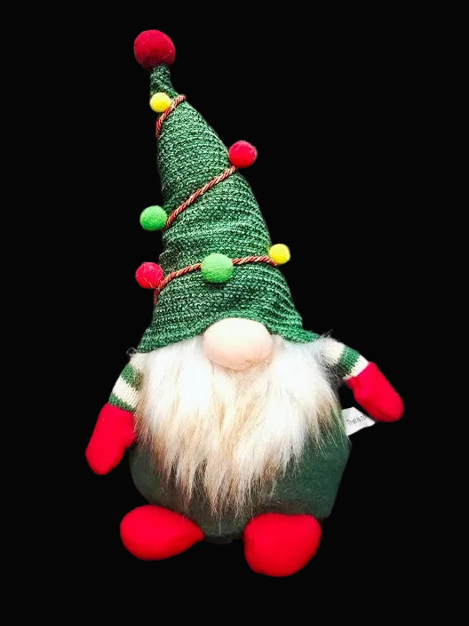 Christmas-themed gnome with a green hat and red shoes on a dark background