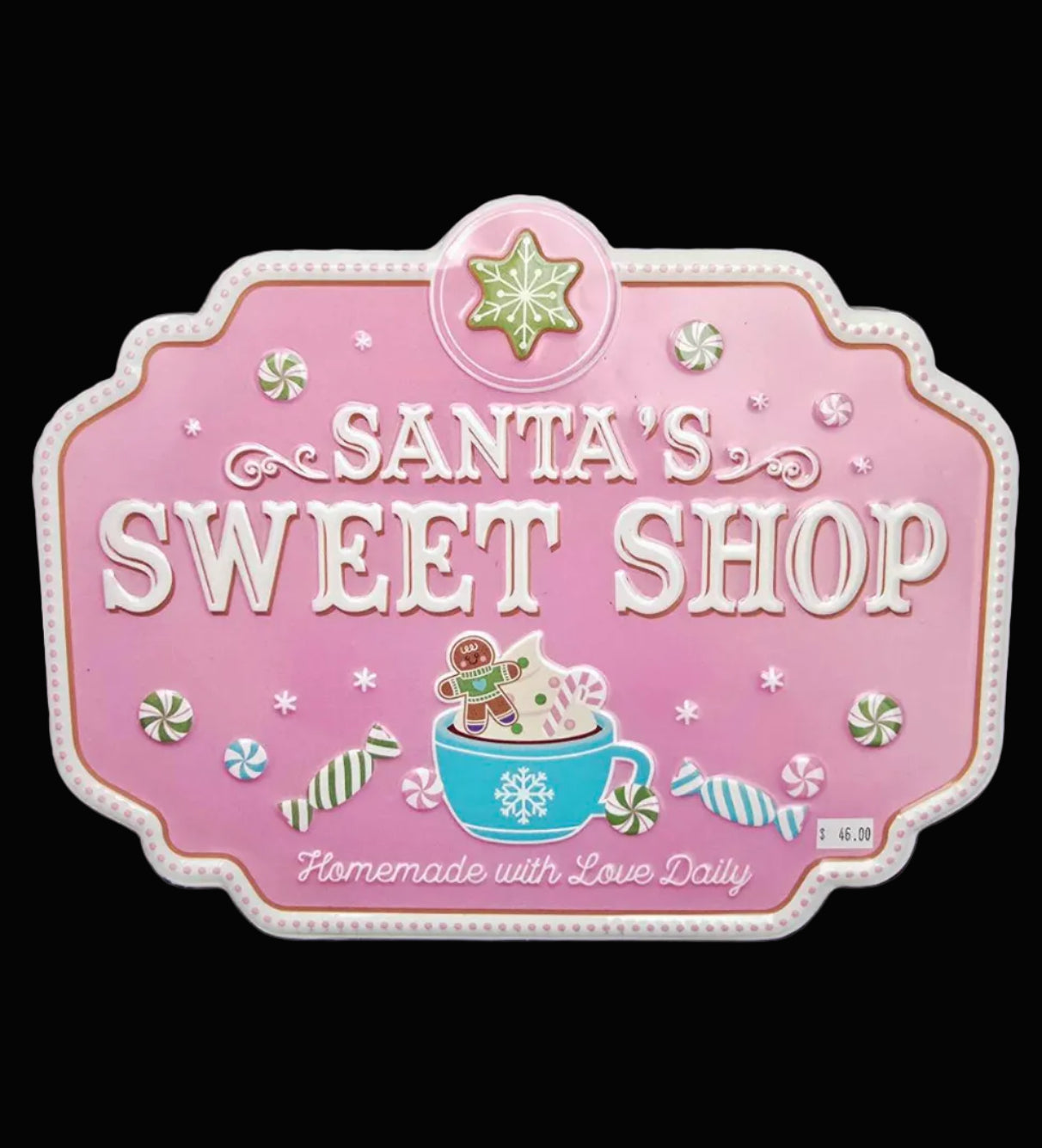 Pink embossed metal tin sign reading Santa's Sweet Shop Homemade with Love Daily with hot cocoa, gingerbread man, peppermint and snowflake detail on black background — Mistletoe Home
