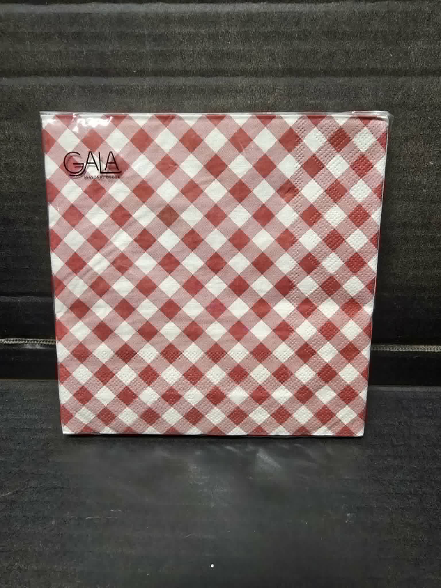 Pack of 20 red and white gingham print Gala paper napkins in clear packaging on dark background — Mistletoe Home