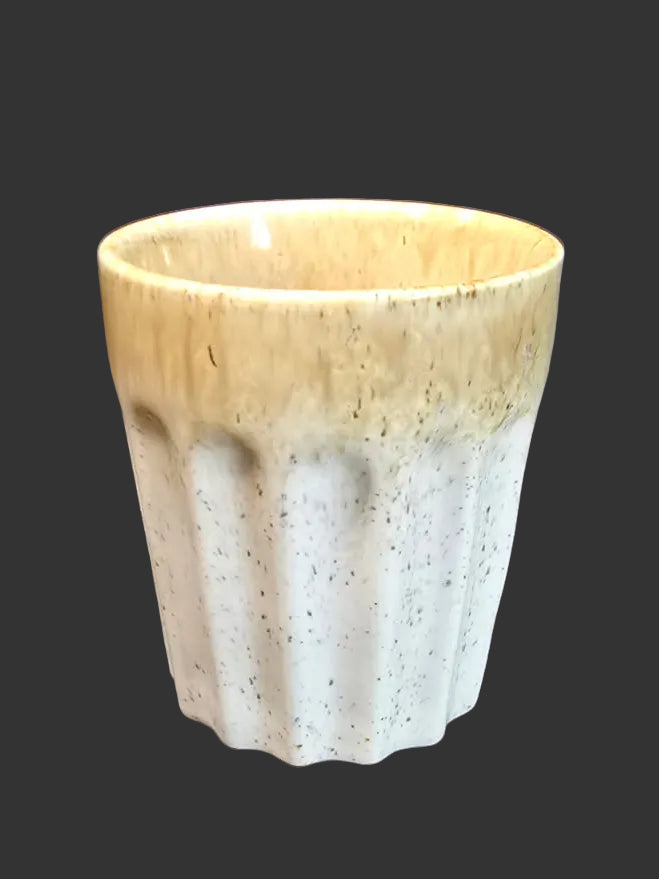 Speckled ceramic latte cup with sandy glaze top and scalloped white base on dark background — unique coffee cup Australia Mistletoe Home